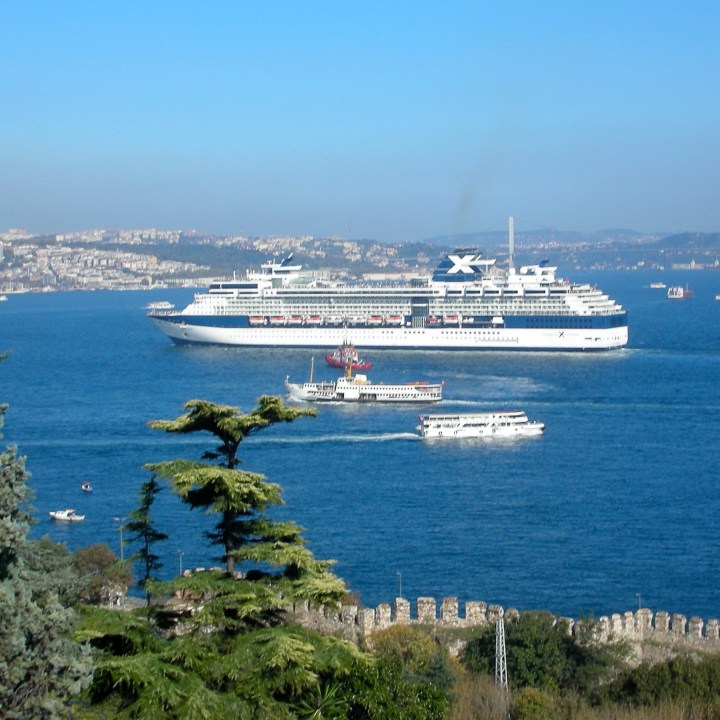 Cruise ship arriving in Istanbul with ferries in foreground