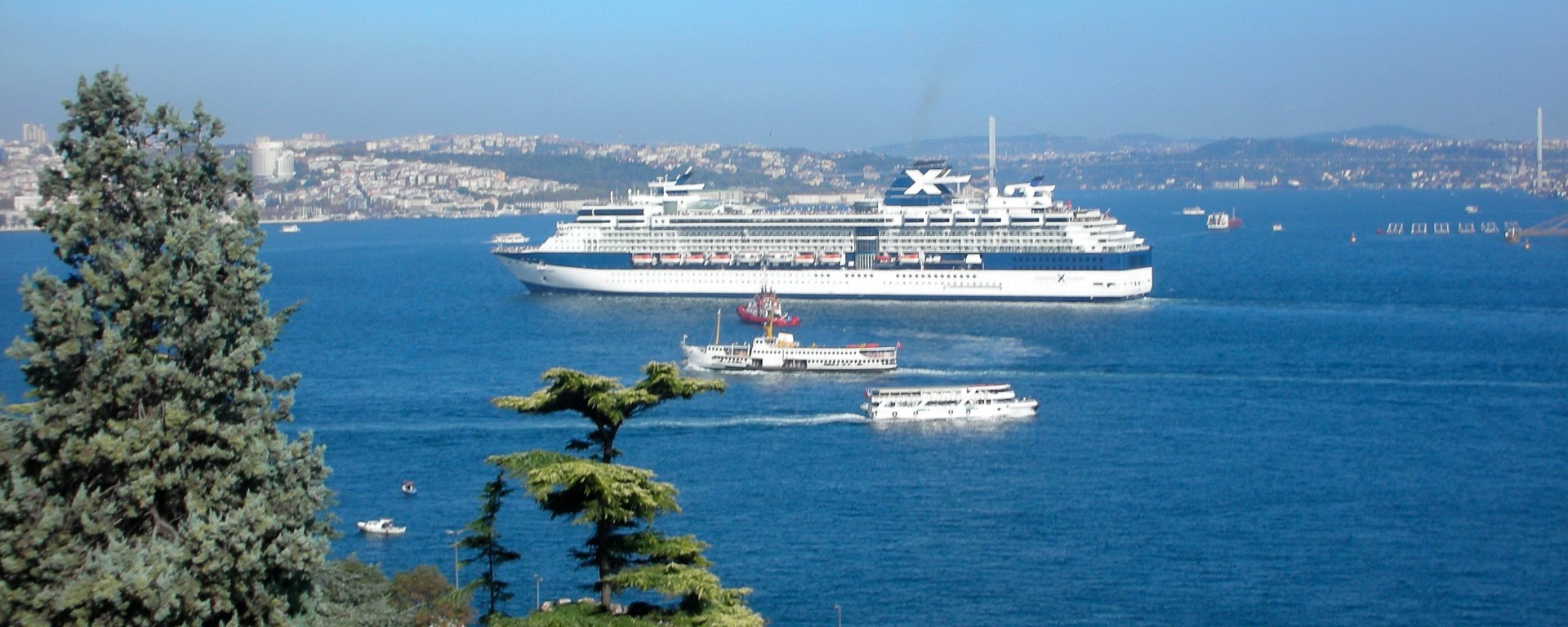Cruise ship arriving in Istanbul with ferries in foreground