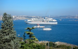 Cruise ship arriving in Istanbul with ferries in foreground