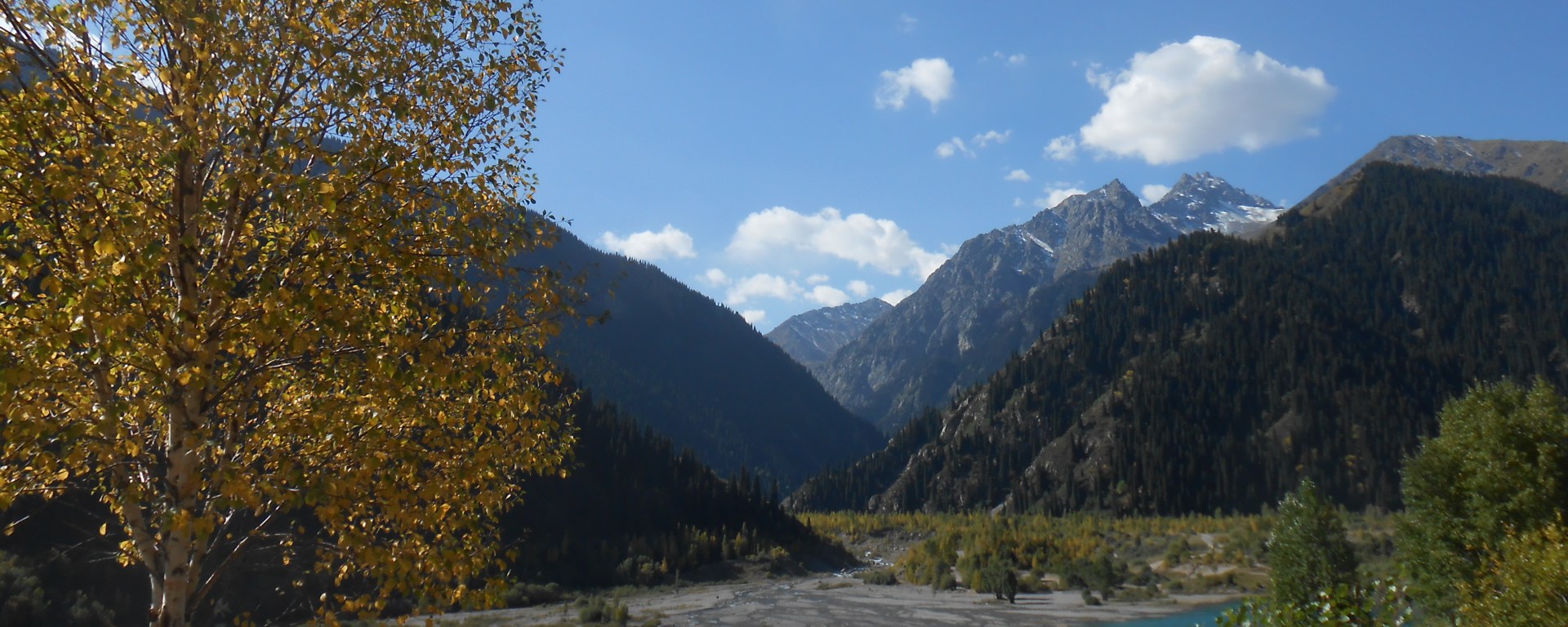 Golden fall foliage and a mountain lake in Kazakhstan