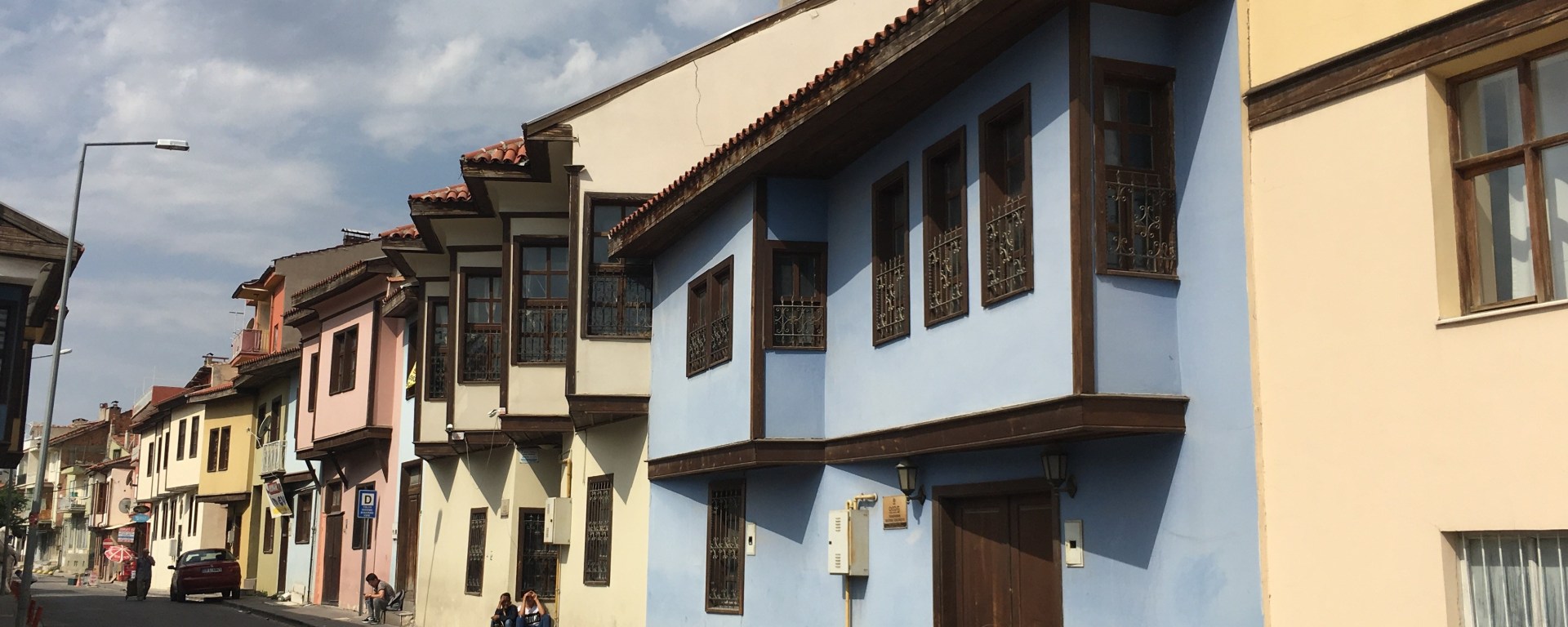 colorful pastel traditional houses adorn a street in central Turkey