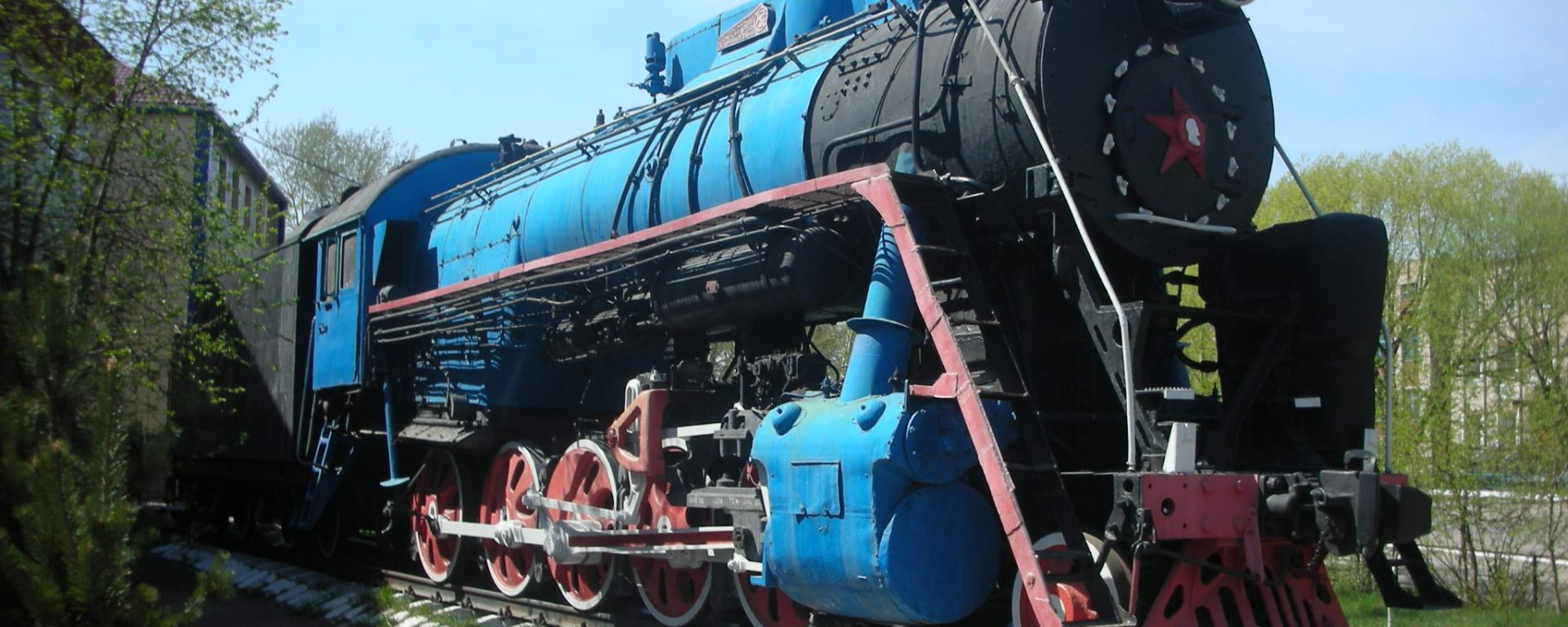 giant blue and red steam engine on display in northern Kazakhstan