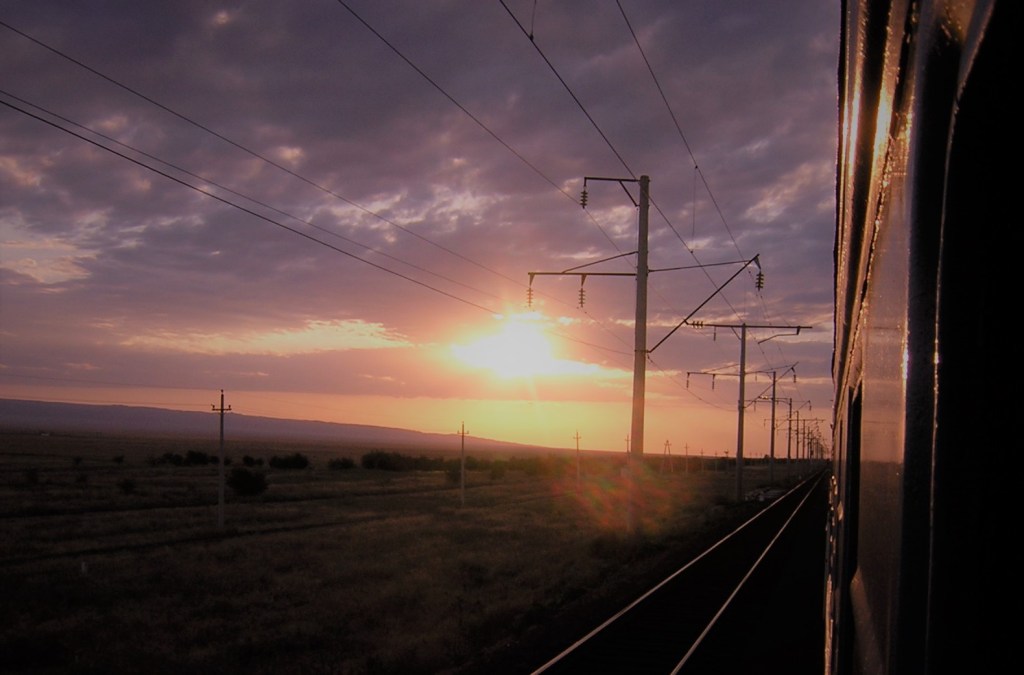 The sun setting as seen from a northbound Kazakhstan train window