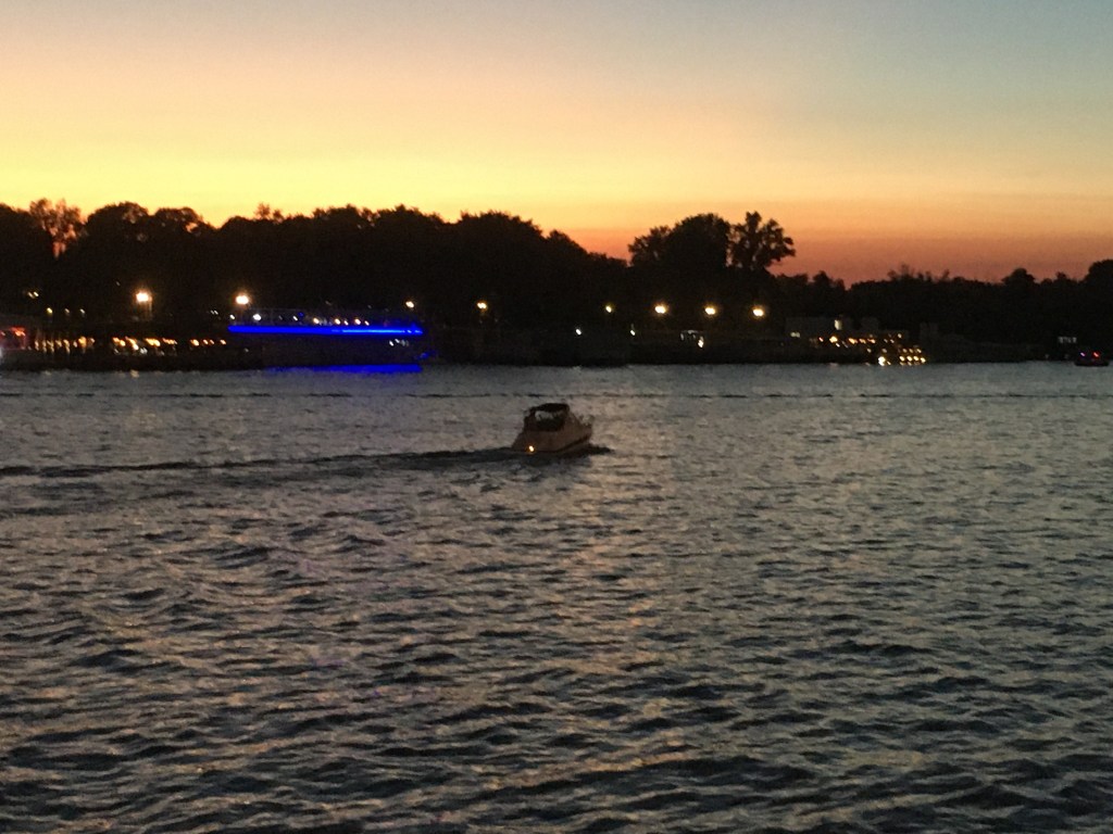 boat on Sava River at sundown in Belgrade city