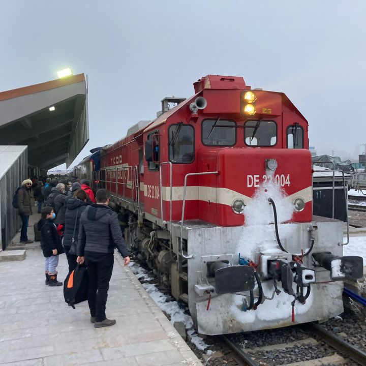 bright red locomotive at station